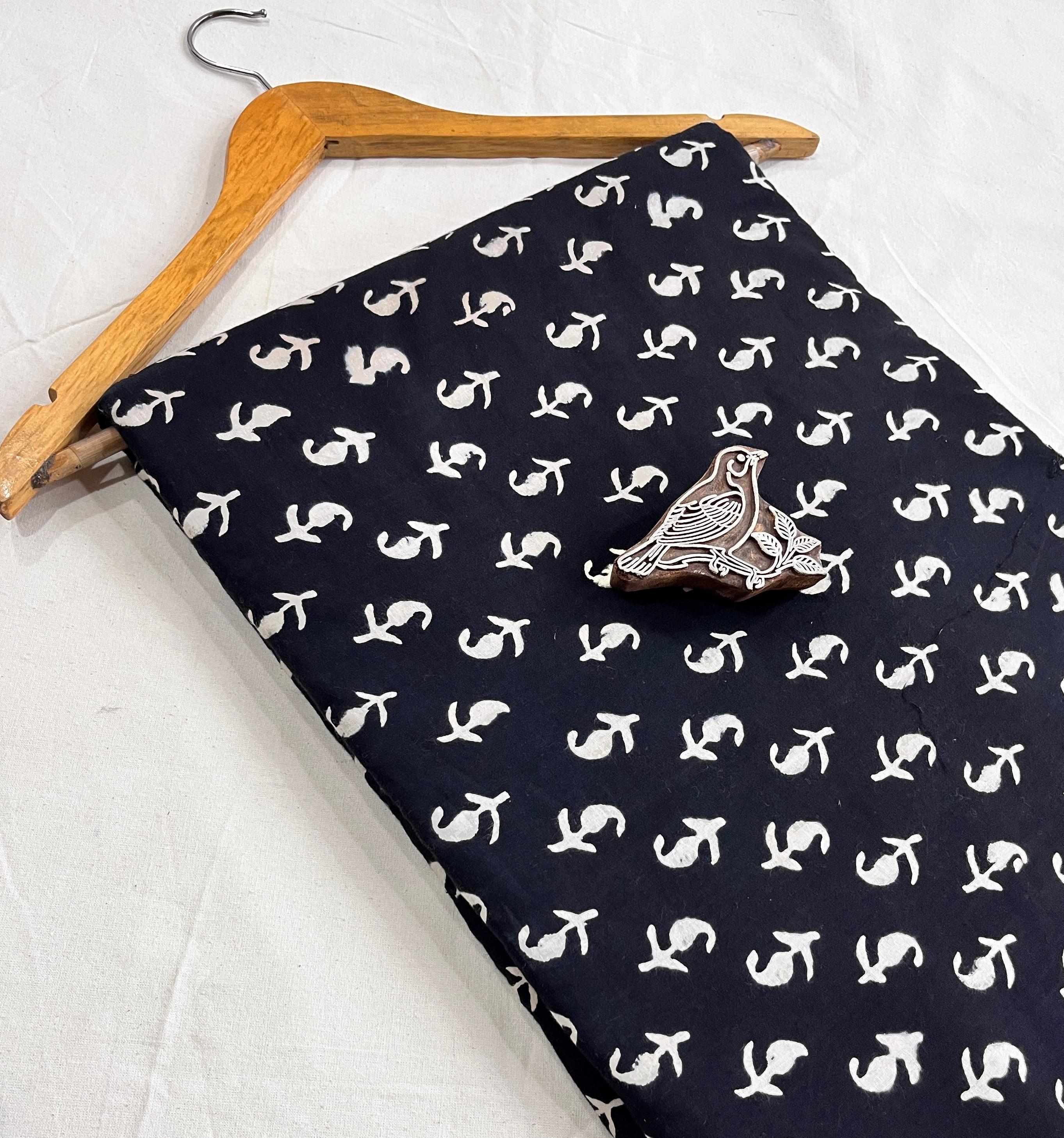 Classic black Dabu mud-resist handblock printed pure cotton fabric, wholesale artisan textile available exclusively at Fabtex.